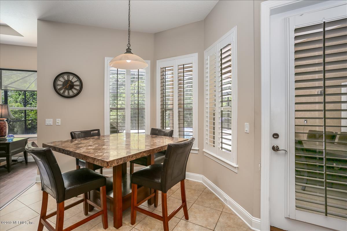 508 Sebastian Square St. Augustine, FL 32095 - Photo 16 of 46 a dining room with a wooden table and chairs