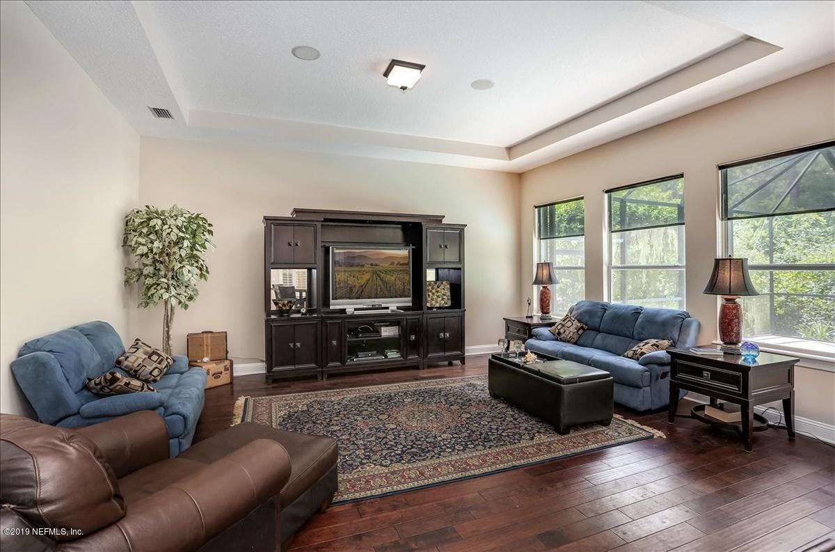 508 Sebastian Square St. Augustine, FL 32095 - Photo 17 of 46 a living room with furniture and a flat screen tv