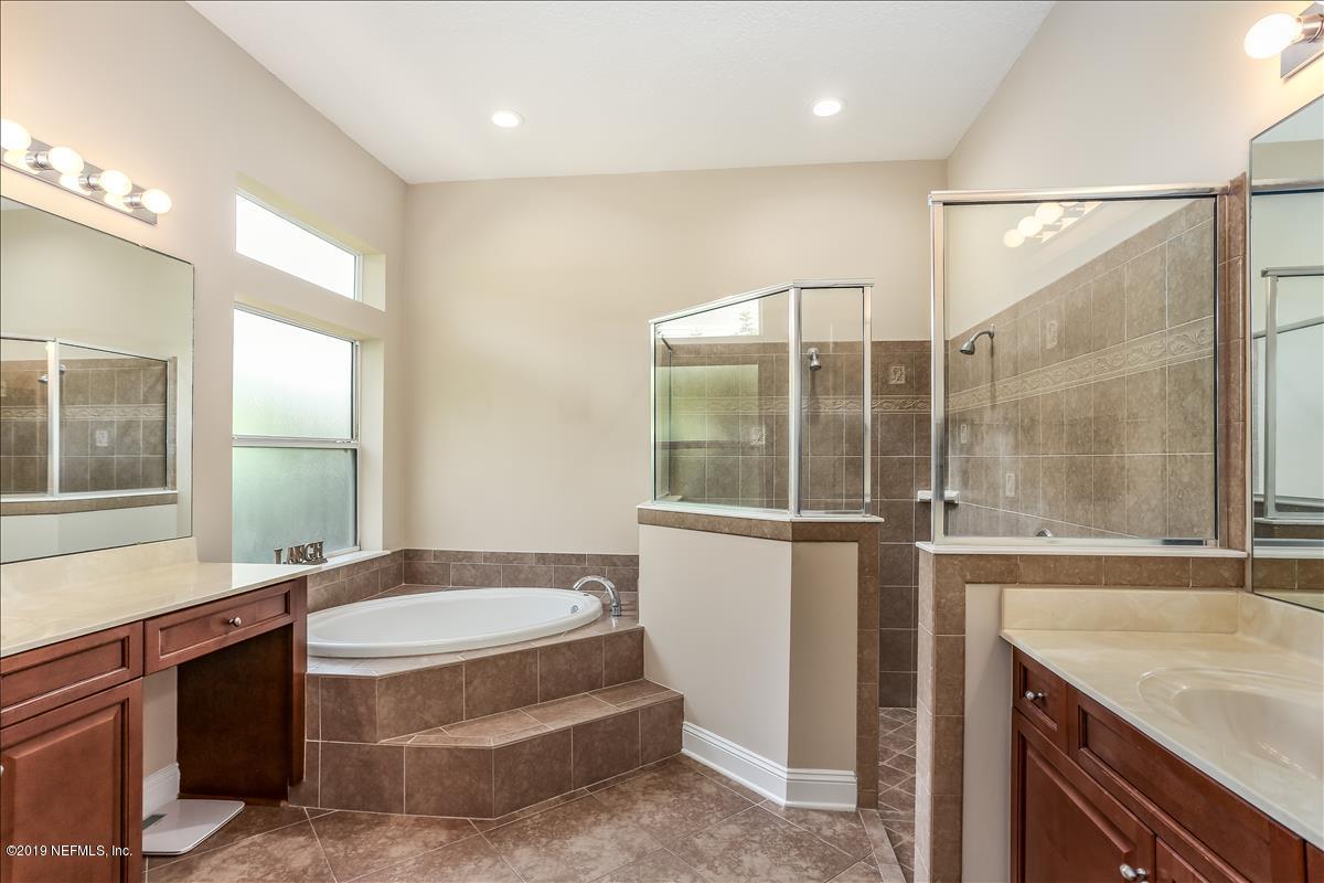 508 Sebastian Square St. Augustine, FL 32095 - Photo 26 of 46 a bathroom with a granite countertop sink and a mirror