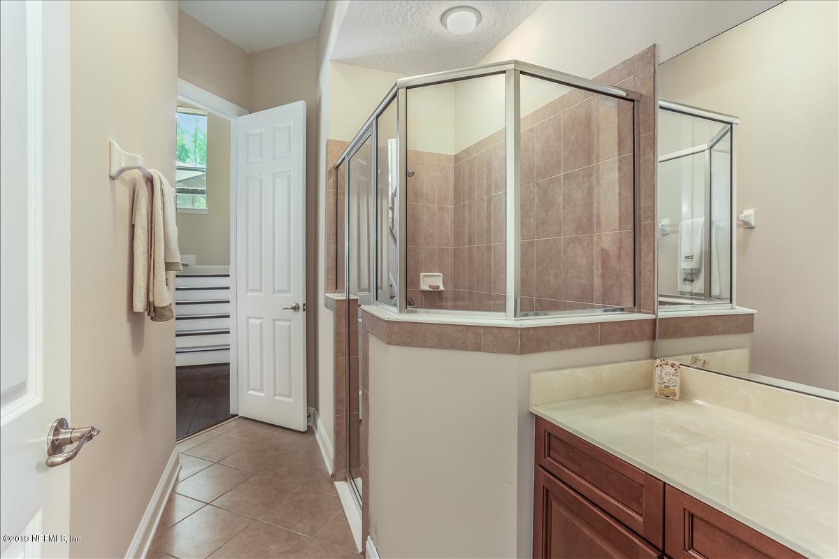 508 Sebastian Square St. Augustine, FL 32095 - Photo 30 of 46 a bathroom with a sink and a mirror
