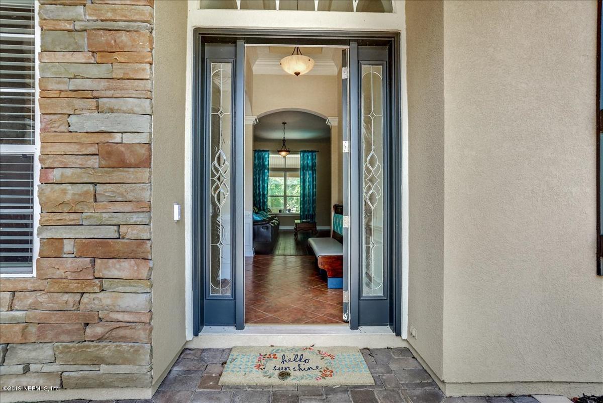 508 Sebastian Square St. Augustine, FL 32095 - Photo 3 of 46 a view of a hallway with wooden door and windows