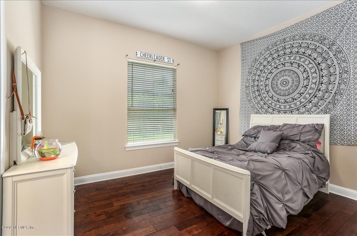 508 Sebastian Square St. Augustine, FL 32095 - Photo 31 of 46 a bed sitting in a bedroom next to a window