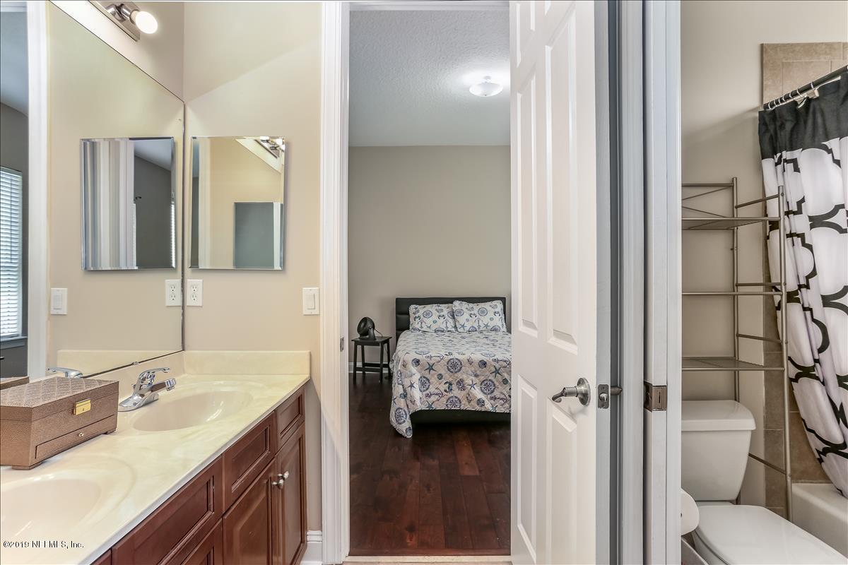 508 Sebastian Square St. Augustine, FL 32095 - Photo 32 of 46 a en suite bathroom with a sink double vanity and a mirror