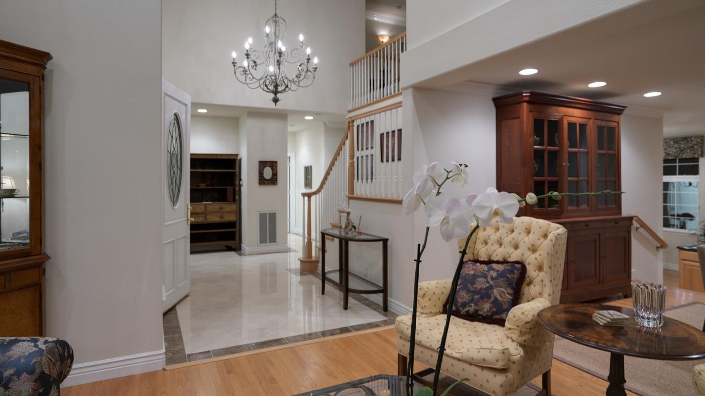 7 Turnberry Road Half Moon Bay, CA 94019 - Photo 13 of 40 a living room with furniture and a chandelier