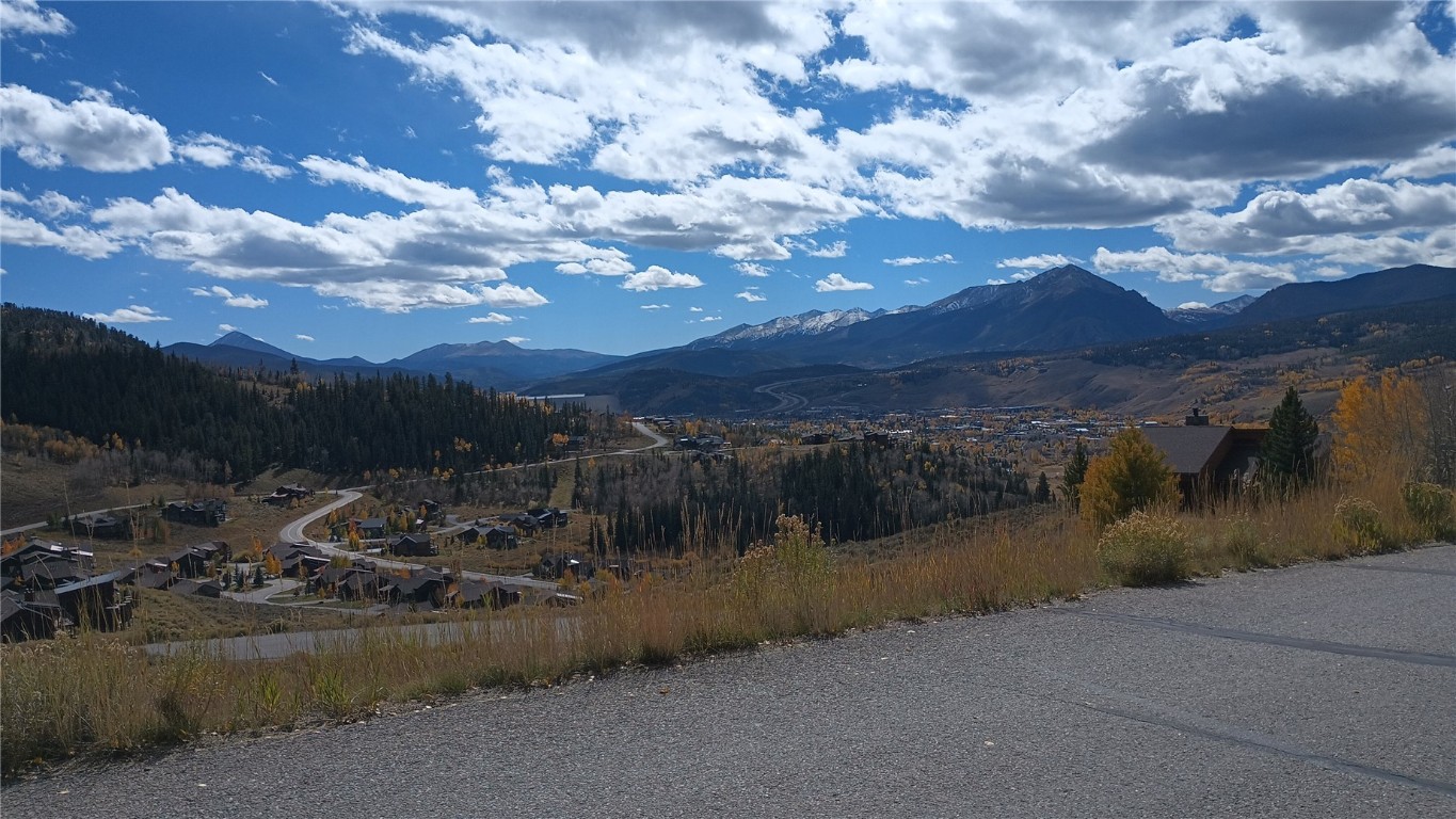 161 Angler Mountain Road Silverthorne, CO 80498 - Photo 5 of 7 a view of a lake with mountains in the background