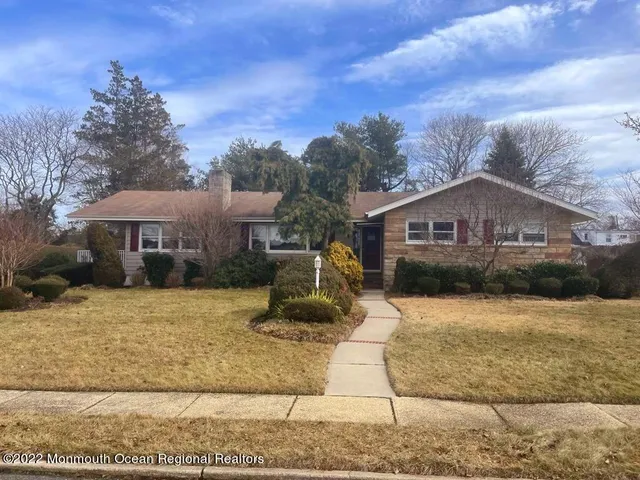 a front view of house with yard outdoor seating and barbeque oven