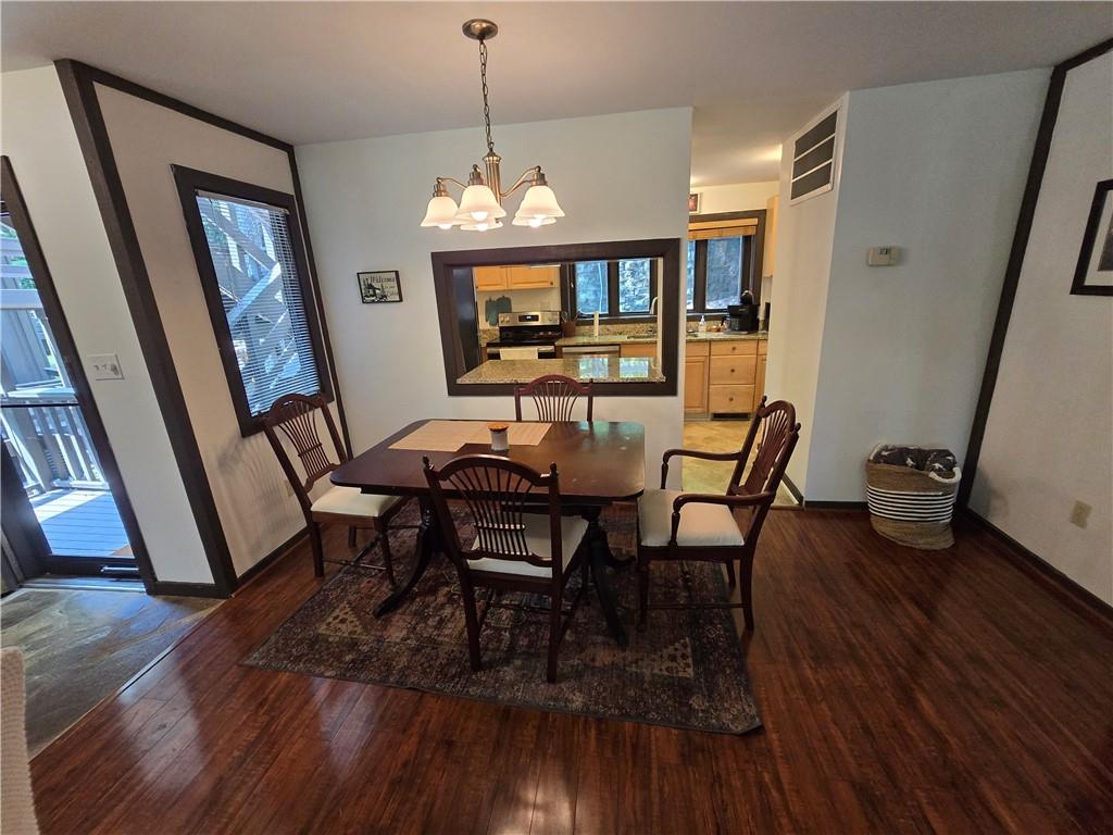 34 Sconti Ridge, Unit 405 Jasper, GA 30143 - Photo 6 of 14 a view of a dining room with furniture and wooden floor