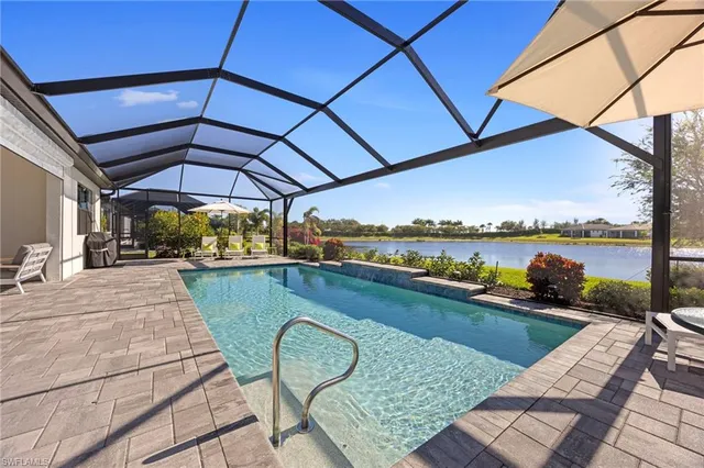 a view of a swimming pool with a lounge chairs