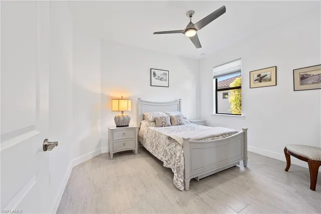 a bedroom with a bed and a table