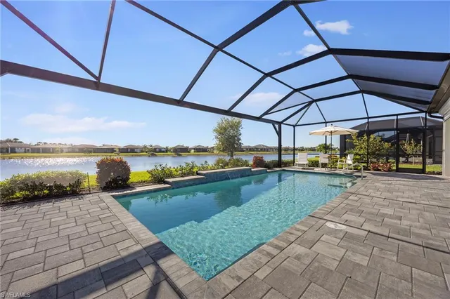 a view of a swimming pool and lounge chair