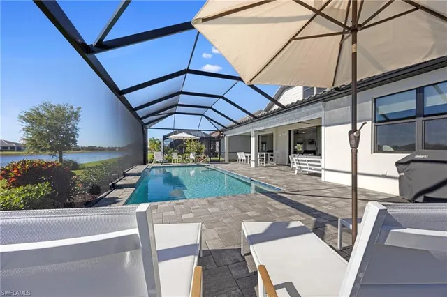 a view of a backyard with sitting area