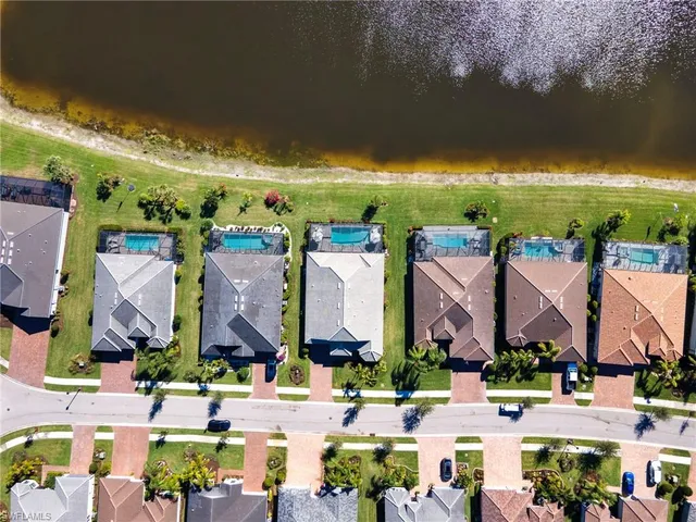 a view of an swimming pool and outdoor seating