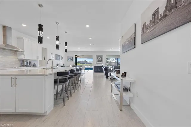 a kitchen with lots of counter top space and furniture