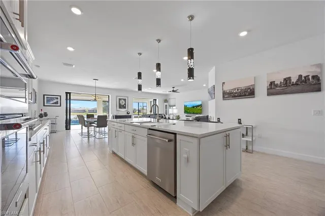 a kitchen with cabinets and wooden floor