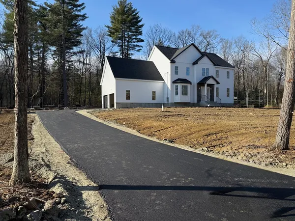a front view of a house with yard