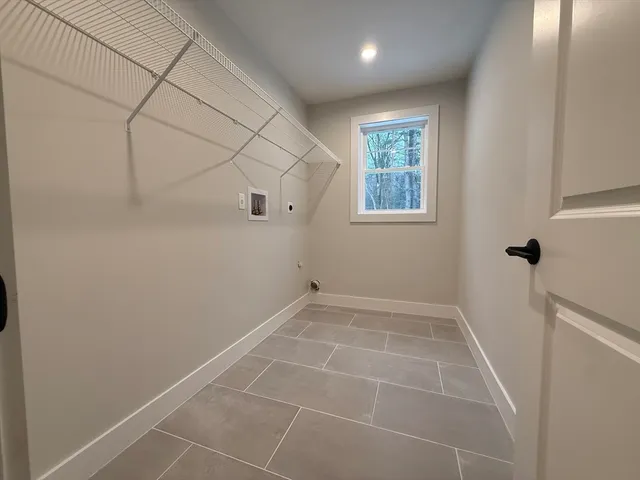 a view of an empty room with windows