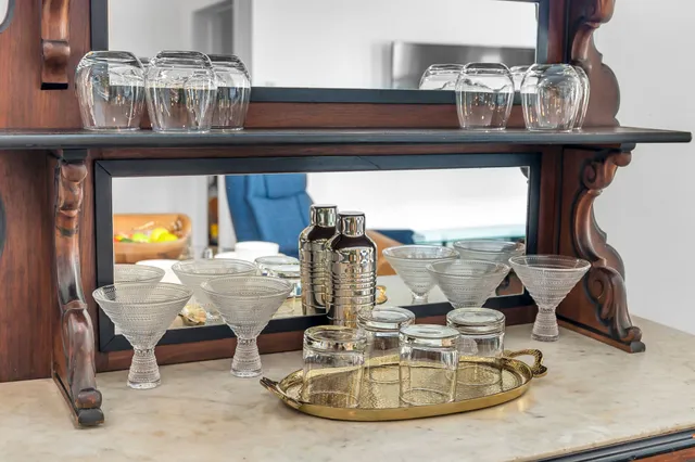 a view of hall way with furniture and chandelier