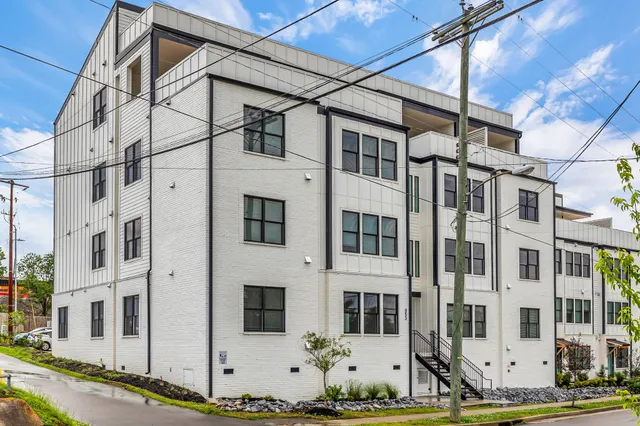 a view of a white building with windows