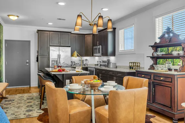 a kitchen with granite countertop a sink and a stove