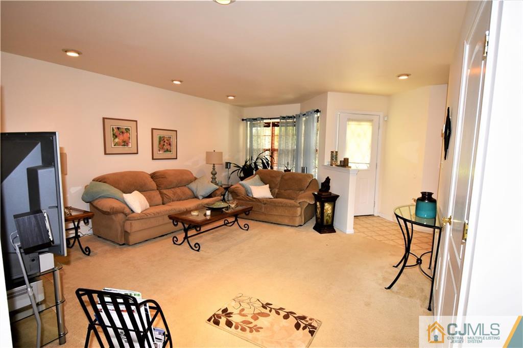 304 Hawthorne Road North Brunswick, NJ 08902 - Photo 2 of 25 a living room with furniture potted plant and open kitchen view