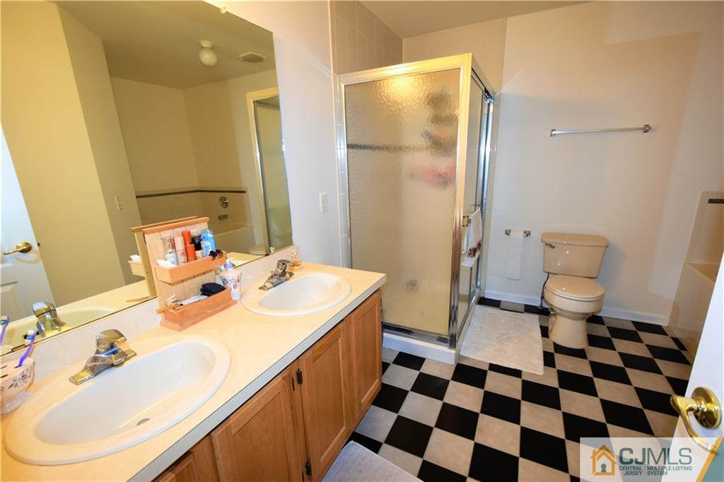 304 Hawthorne Road North Brunswick, NJ 08902 - Photo 15 of 25 a bathroom with a sink toilet and shower
