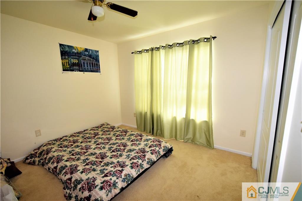 304 Hawthorne Road North Brunswick, NJ 08902 - Photo 19 of 25 a bedroom with a bed and a window