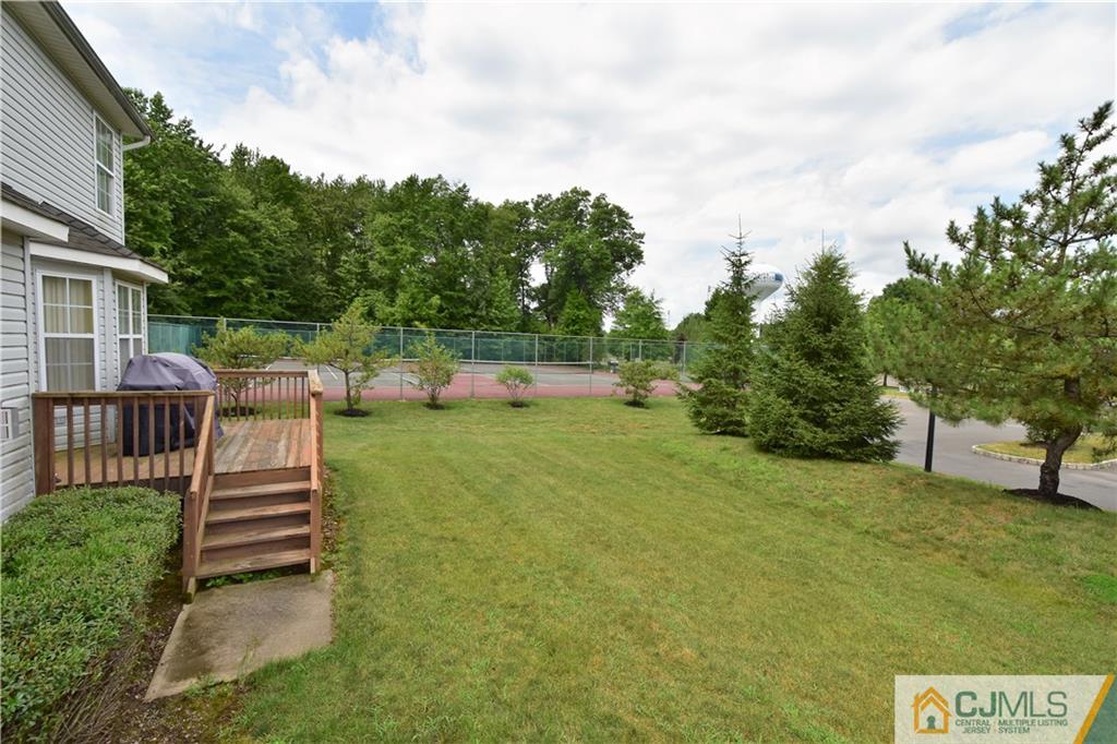 304 Hawthorne Road North Brunswick, NJ 08902 - Photo 24 of 25 a front view of a house with a yard and trees