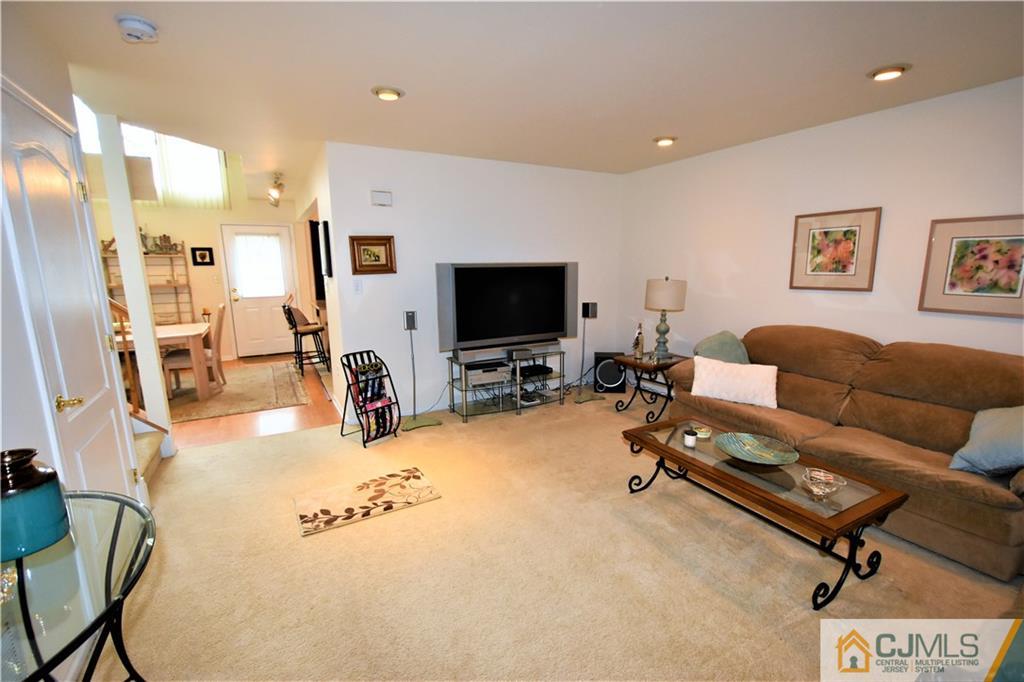 304 Hawthorne Road North Brunswick, NJ 08902 - Photo 4 of 25 a living room with furniture and a flat screen tv