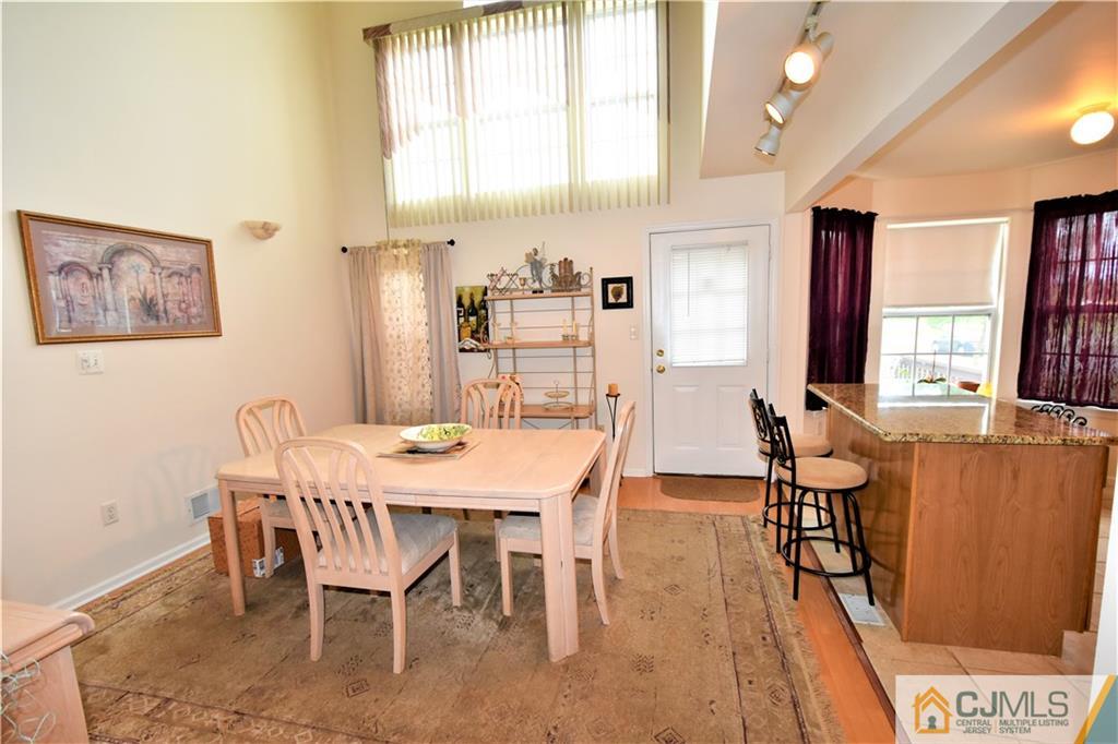 304 Hawthorne Road North Brunswick, NJ 08902 - Photo 5 of 25 a view of a dining room with furniture and a window