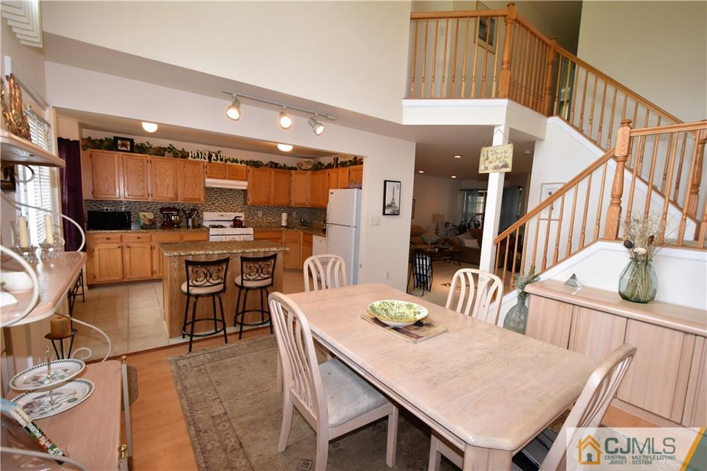 304 Hawthorne Road North Brunswick, NJ 08902 - Photo 7 of 25 a dining room with furniture and wooden floor