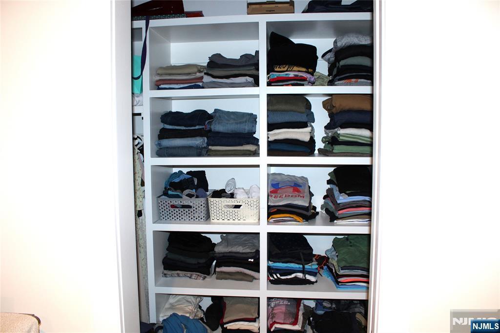 294-296 Tenafly Road Tenafly, NJ 07670 - Photo 16 of 24 a room with a book shelf