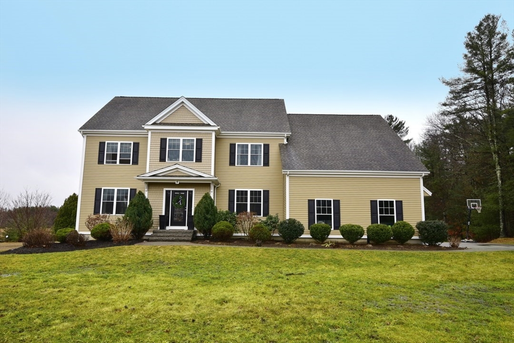 5 Tailwind Circle Norfolk, MA 02056 - Photo 1 of 40 a front view of a house with a garden