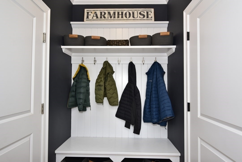 5 Tailwind Circle Norfolk, MA 02056 - Photo 16 of 40 a close view of walk in closet with clothes