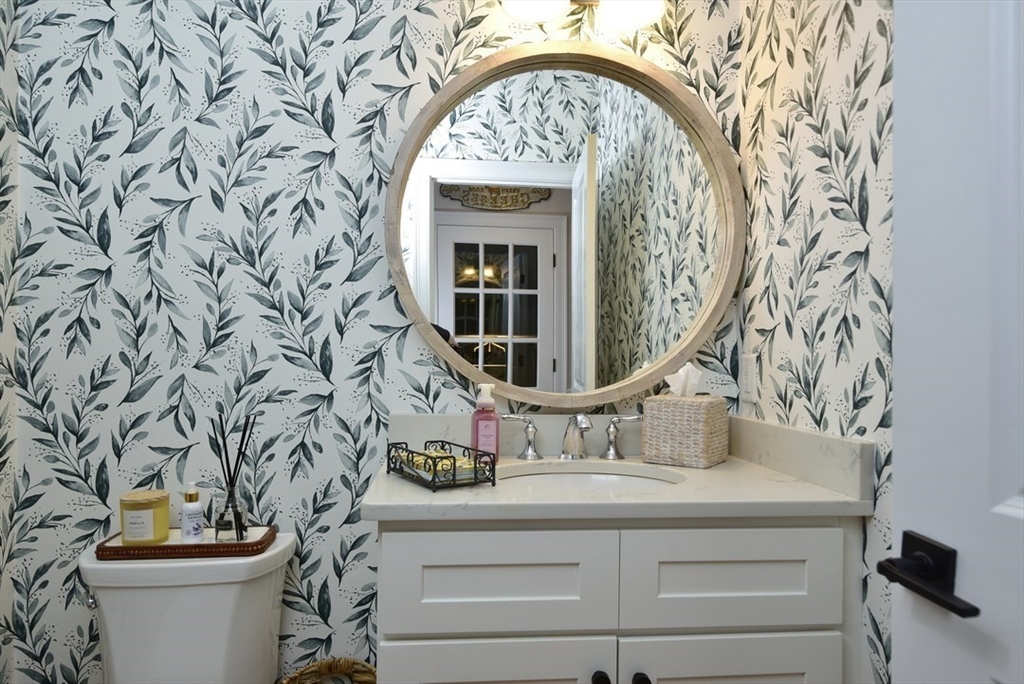 5 Tailwind Circle Norfolk, MA 02056 - Photo 17 of 40 a bathroom with a toilet and a sink