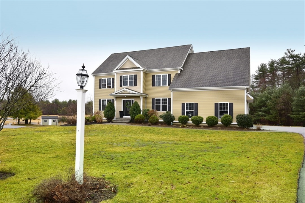5 Tailwind Circle Norfolk, MA 02056 - Photo 2 of 40 a front view of a house with a yard