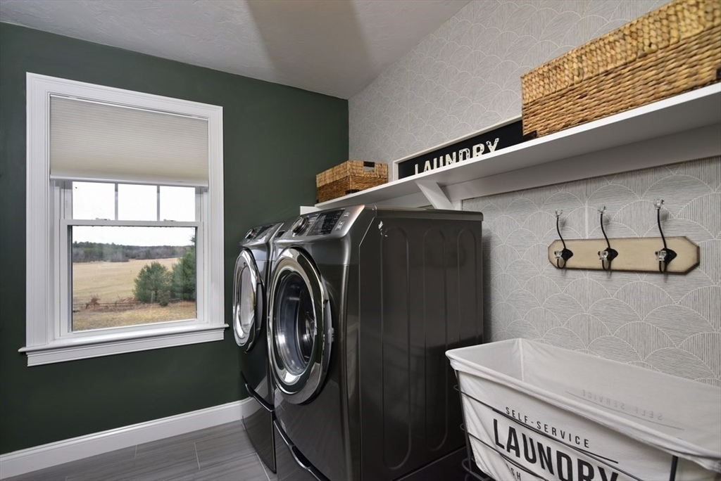 5 Tailwind Circle Norfolk, MA 02056 - Photo 24 of 40 a utility room with dryer and washer