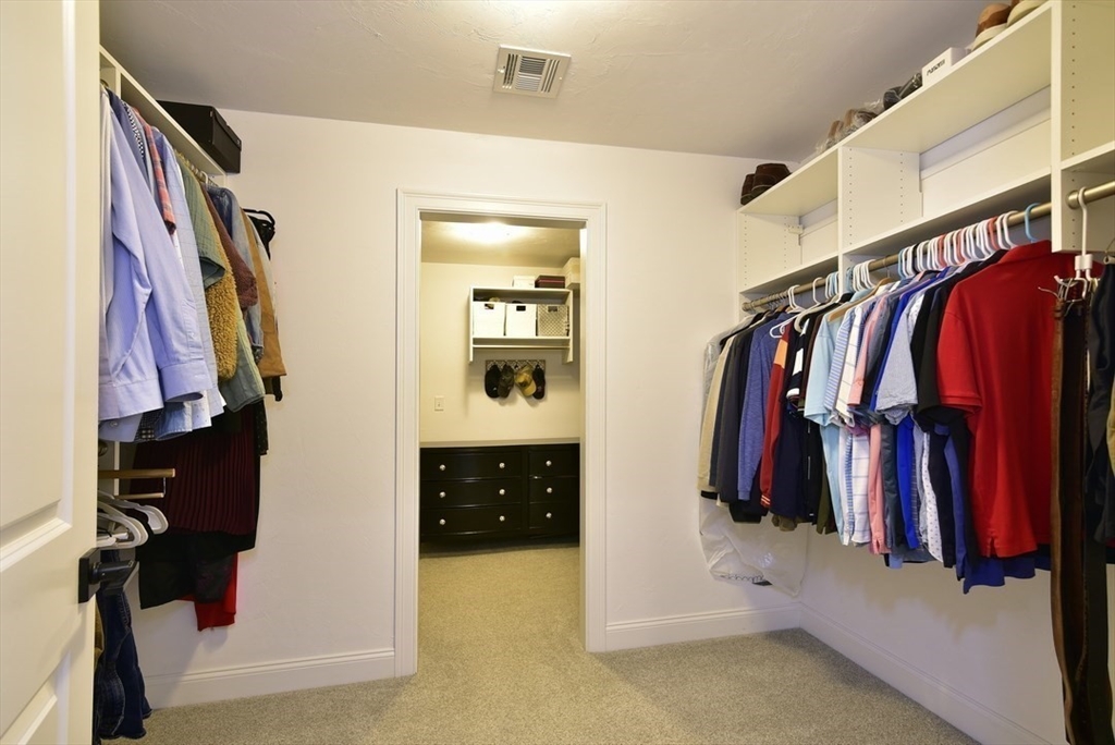 5 Tailwind Circle Norfolk, MA 02056 - Photo 28 of 40 a view of walk in closet with clothes