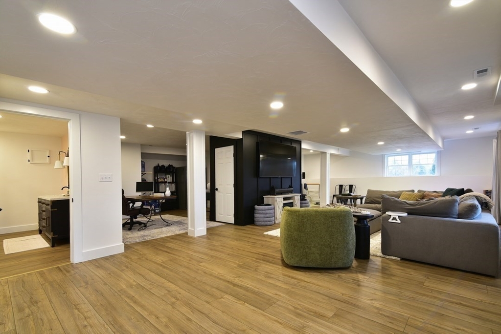 5 Tailwind Circle Norfolk, MA 02056 - Photo 30 of 40 a living room with furniture and a wooden floor