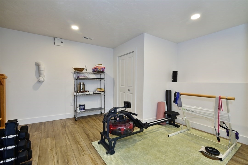 5 Tailwind Circle Norfolk, MA 02056 - Photo 32 of 40 a view of a room with gym equipment