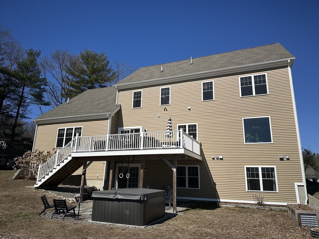 5 Tailwind Circle Norfolk, MA 02056 - Photo 35 of 40 a front view of a house with garage