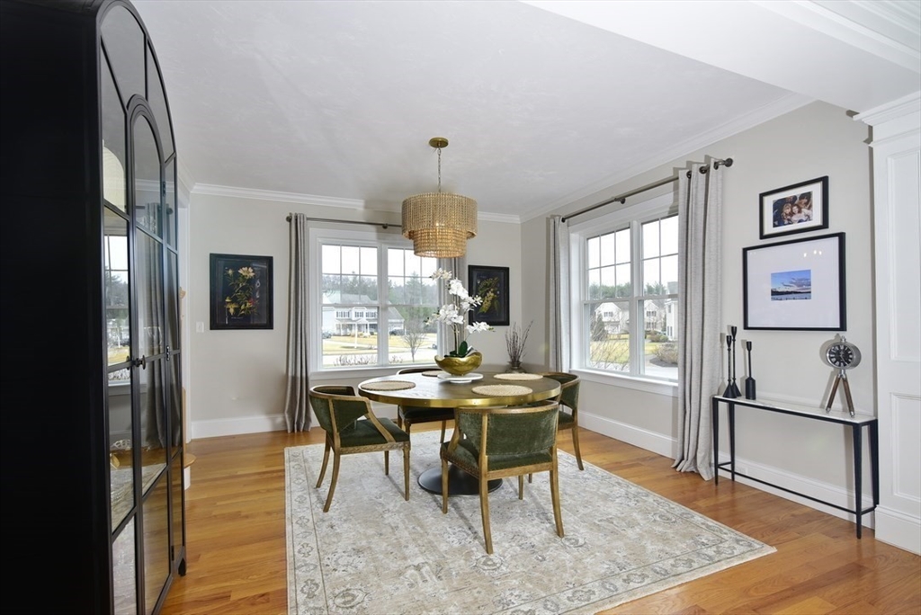 5 Tailwind Circle Norfolk, MA 02056 - Photo 6 of 40 a view of a dining room with furniture window and wooden floor