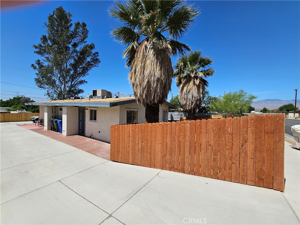 66051 3rd Street, Unit A Desert Hot Springs, CA 92240 - Photo 1 of 14 a view of house with palm trees