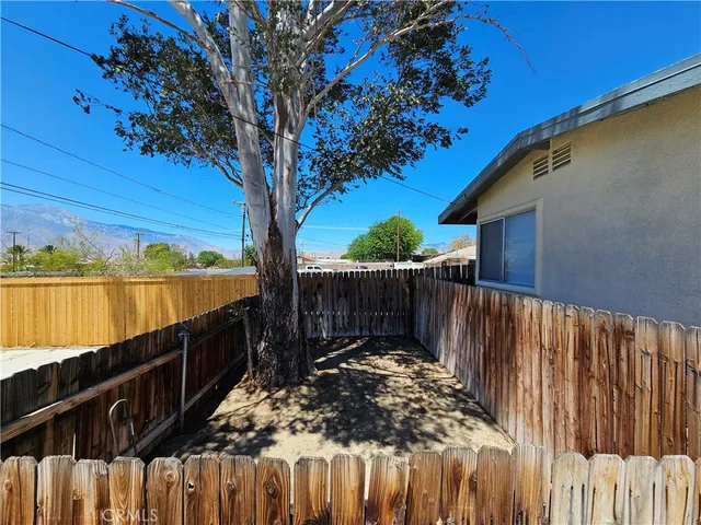 a view of outdoor space with deck and trees