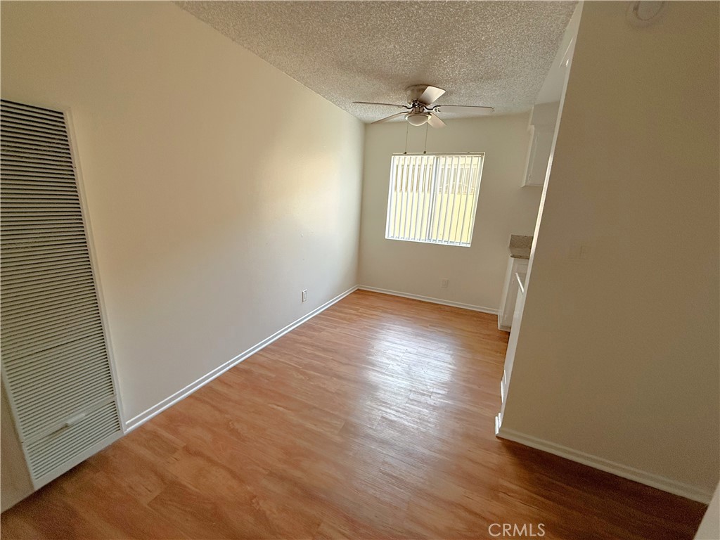 4015 137th Street, Unit 102 Hawthorne, CA 90250 - Photo 14 of 21 an empty room with wooden floor and windows