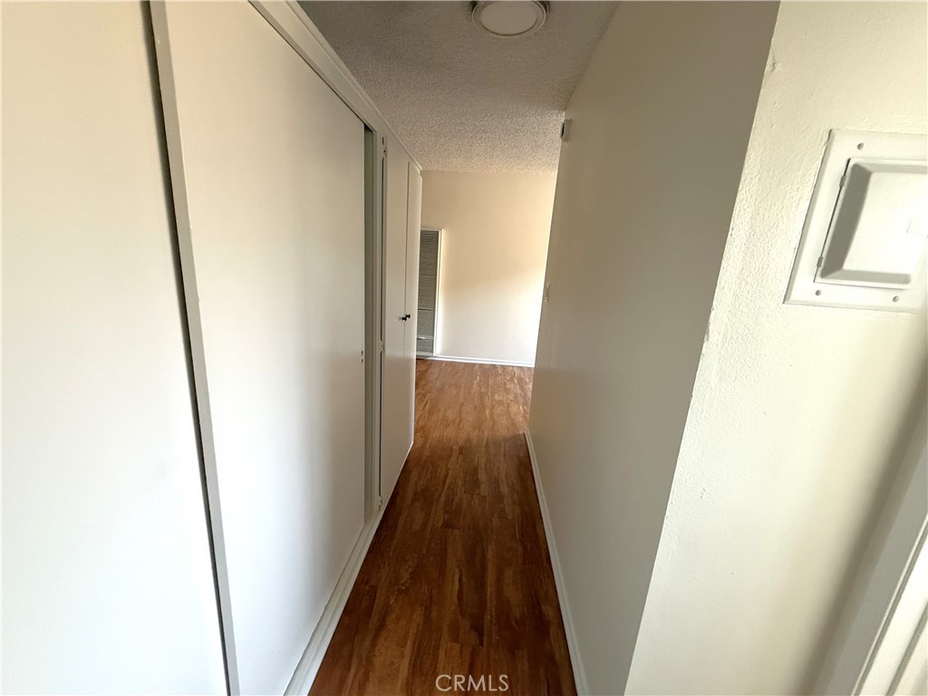 4015 137th Street, Unit 102 Hawthorne, CA 90250 - Photo 17 of 21 a view of hallway with wooden floor