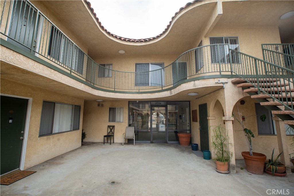 4015 137th Street, Unit 102 Hawthorne, CA 90250 - Photo 3 of 21 a view of a building with hallway