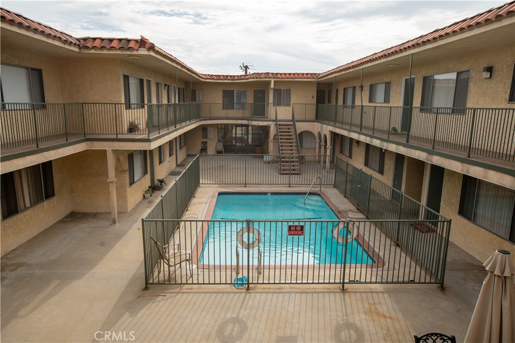 4015 137th Street, Unit 102 Hawthorne, CA 90250 - Photo 7 of 21 a view of balcony with deck and wooden floor