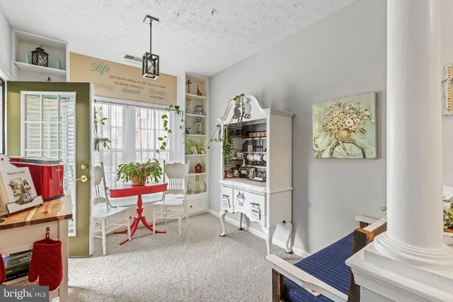 a table and chairs in a room