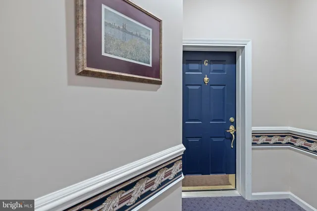 a view of an empty room with closet