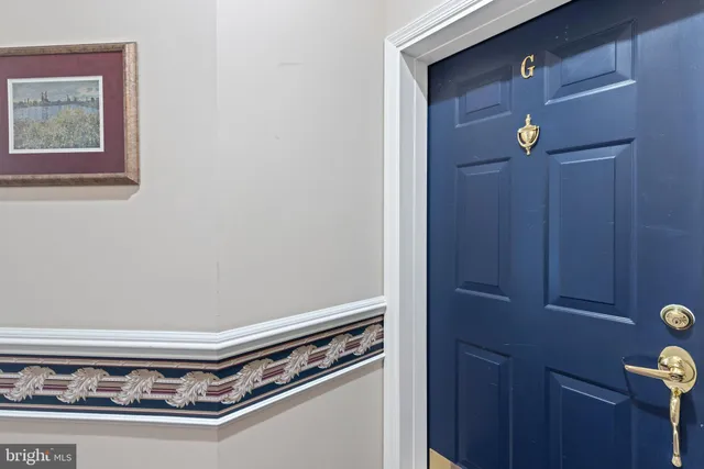 a view of a hallway with a chandelier